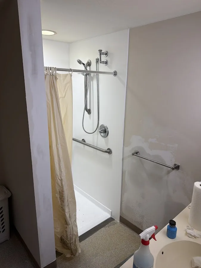 Plumbing technician reviewing findings with a homeowner