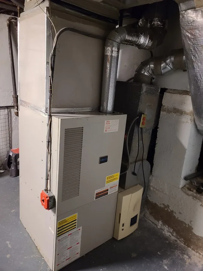 Technician troubleshooting plumbing and HVAC related issues