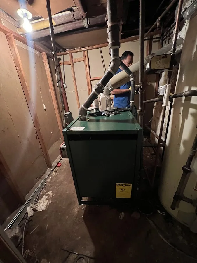 Homeowner reviewing emergency repair details with a technician