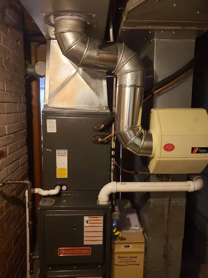 Technician inspecting a leak source during a service call